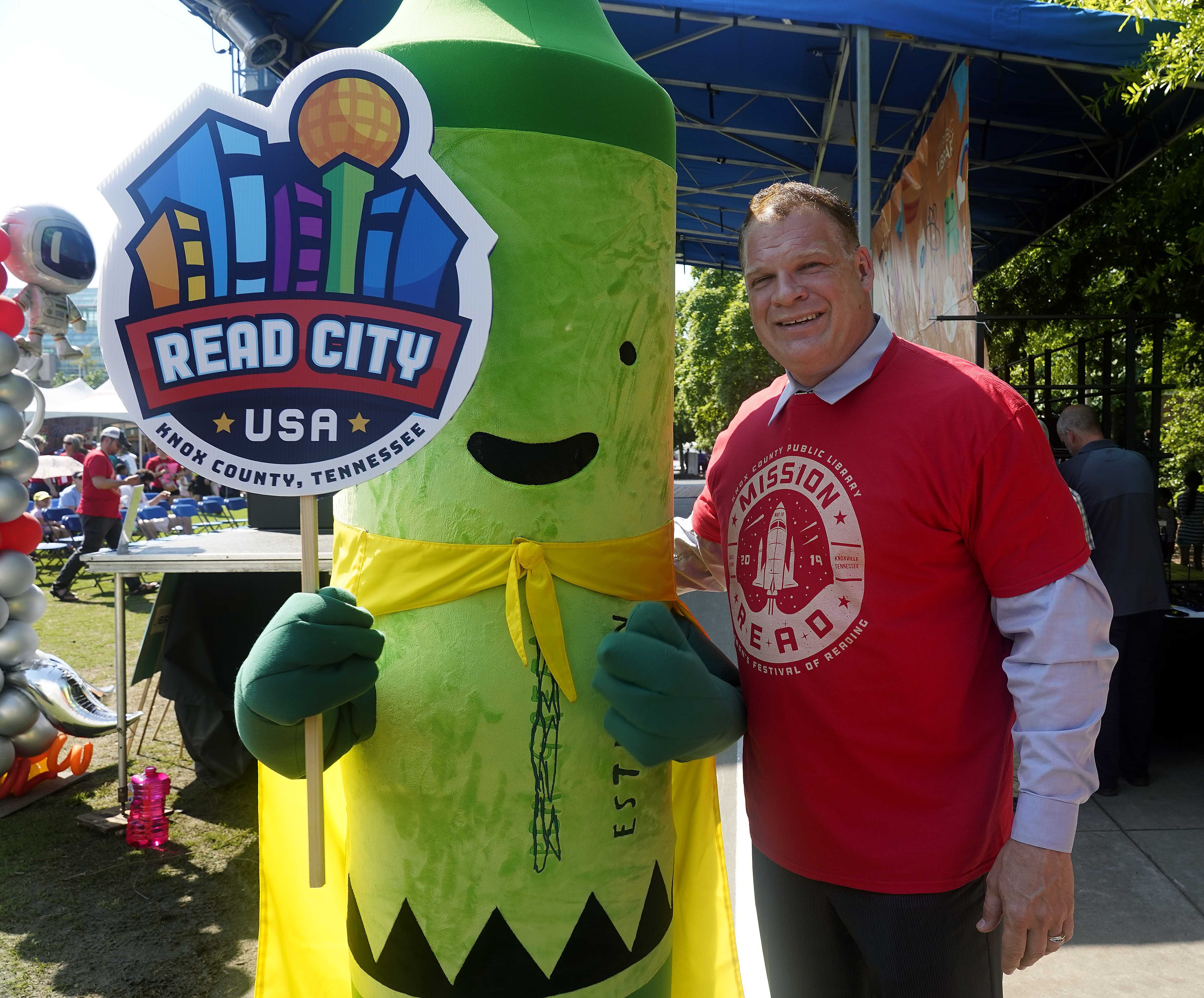 Children's Festival of Reading: Knox County mayor posing with man in crayon suit