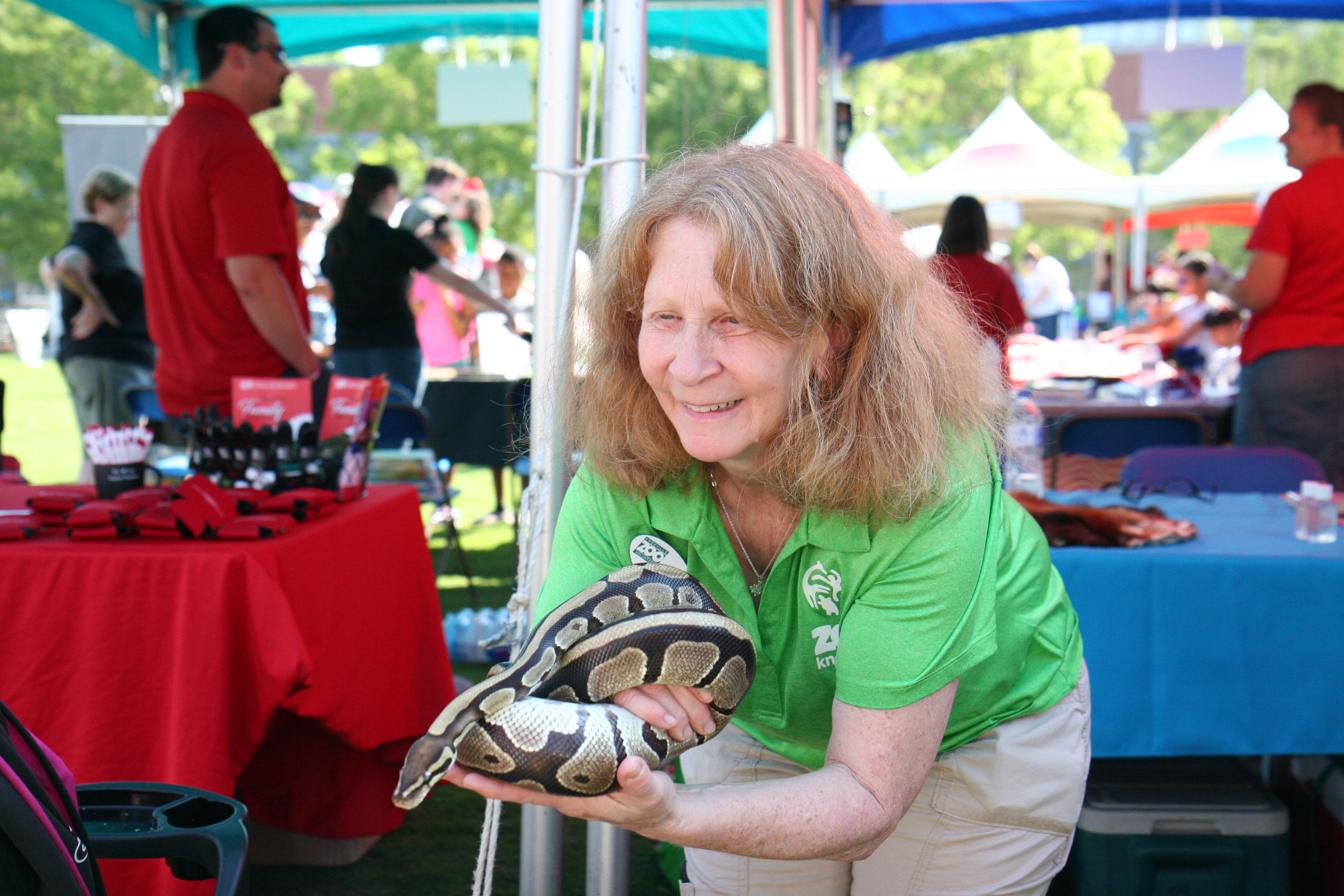 Zoo Presenter holding a snake during the Children's Festival for Reading