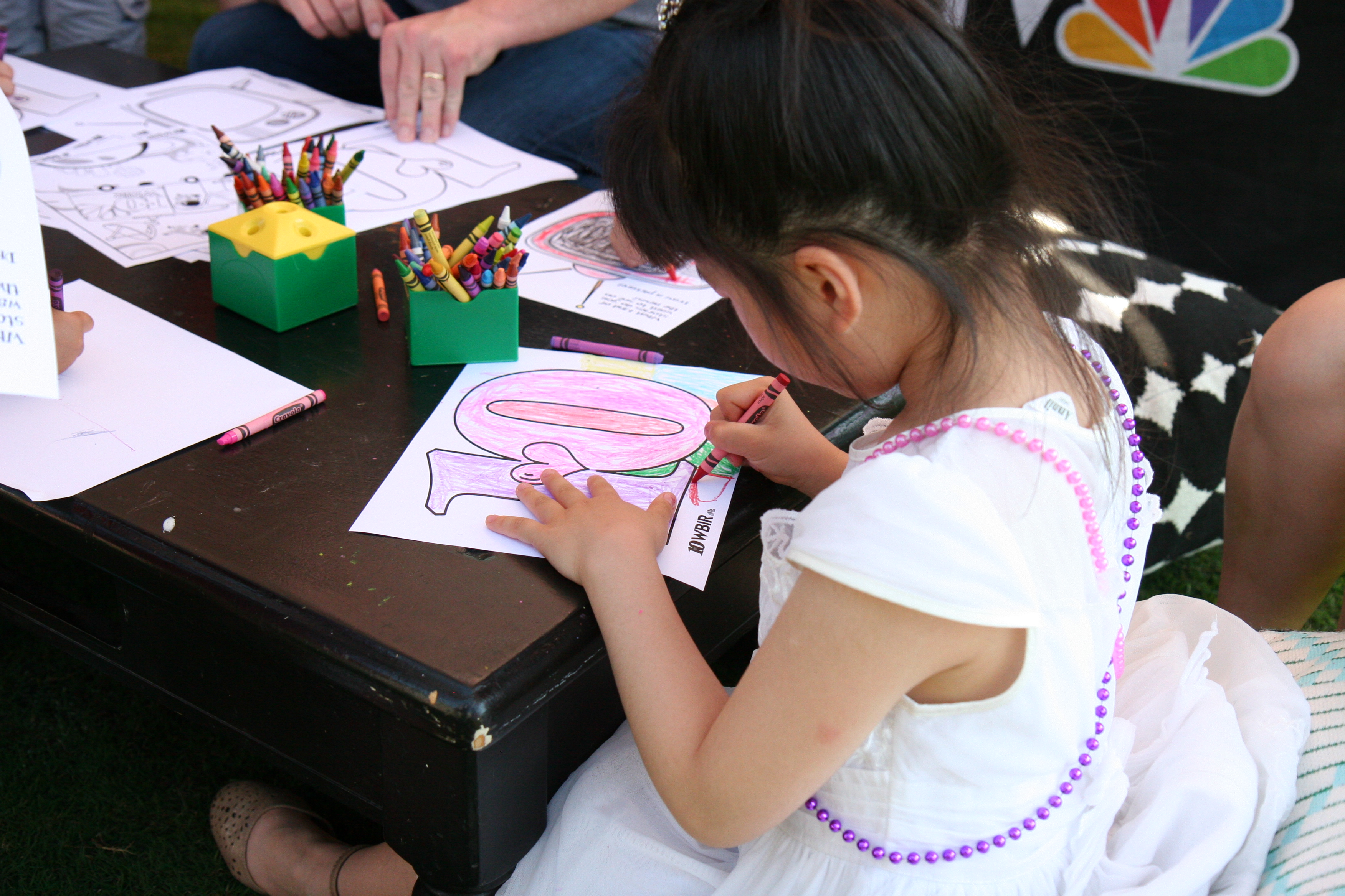 Little girl coloring during the Children's Festival for Reading