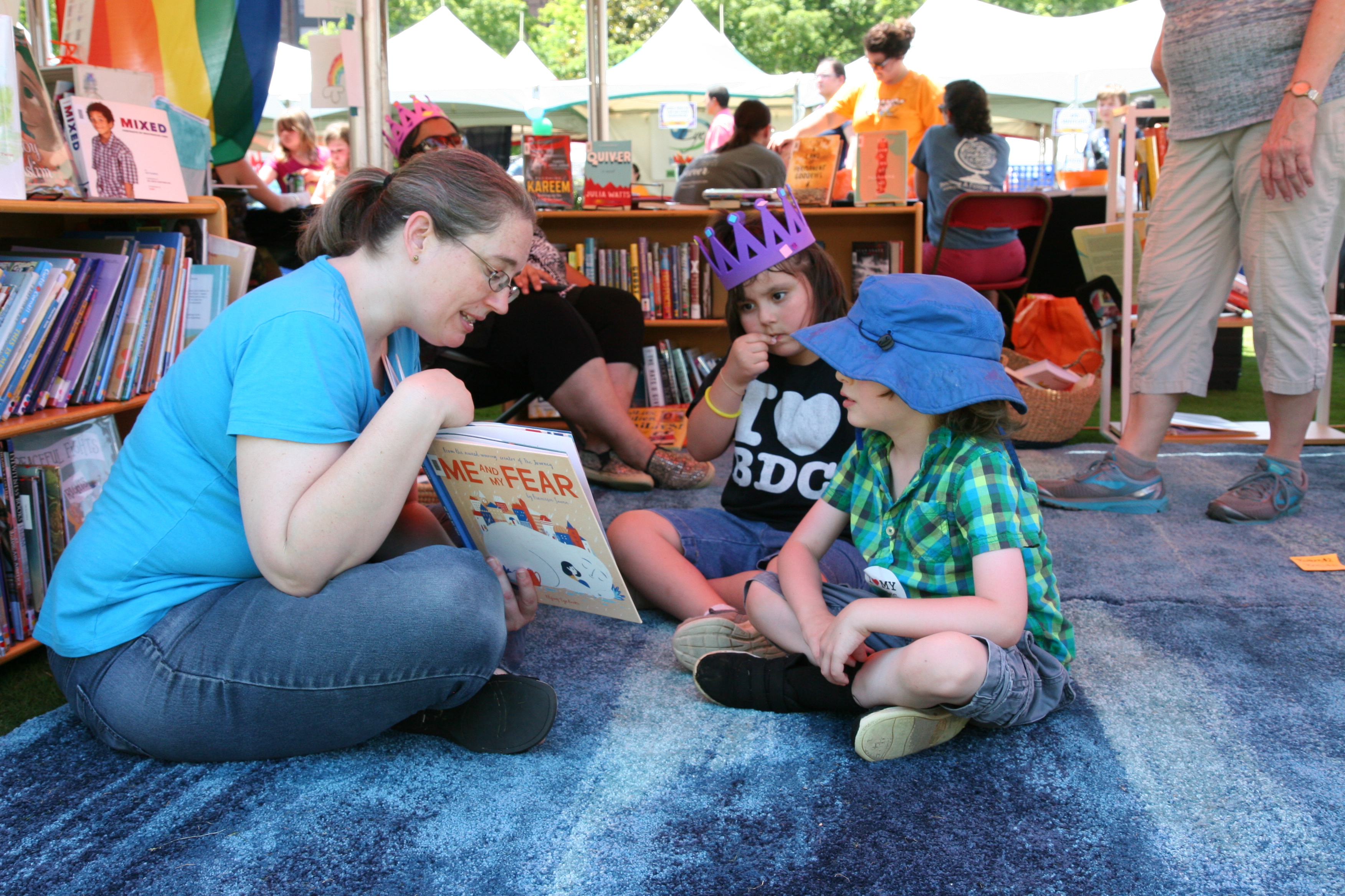 Librarian reading to children during the Children’s Festival of Reading event