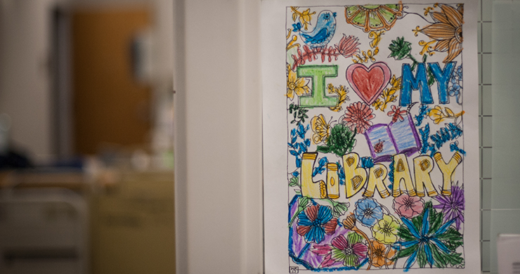 Colorful sign that reads "I Love My Library" made by one of the young patrons