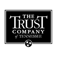 The Trust Company of Tennessee logo. The name of the business is in white font on an black box background with the three stars in a circle from the Tennessee flag on the bottom of the black box