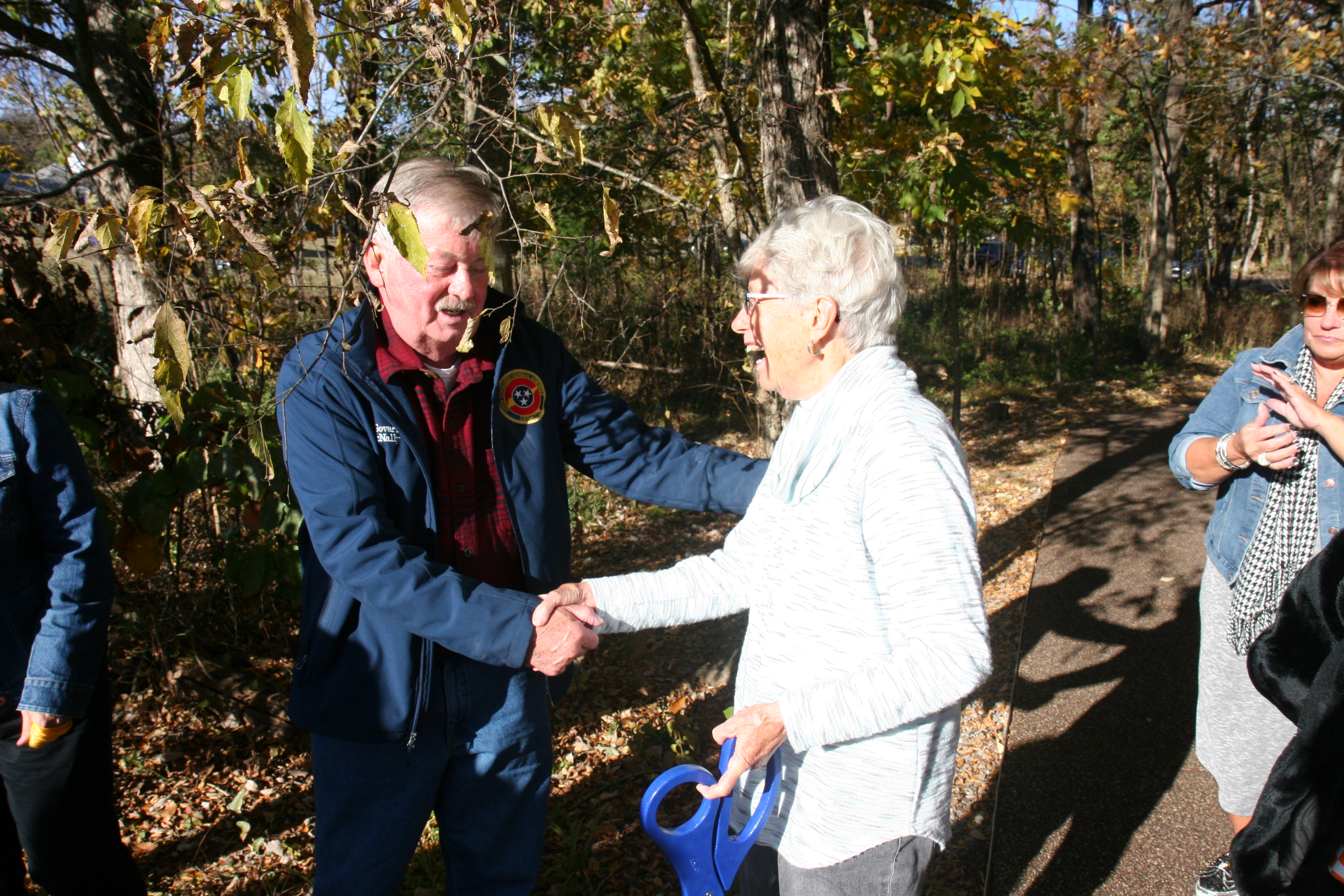 Lt. Governor Randy McNally shakes hands with Louise Collier