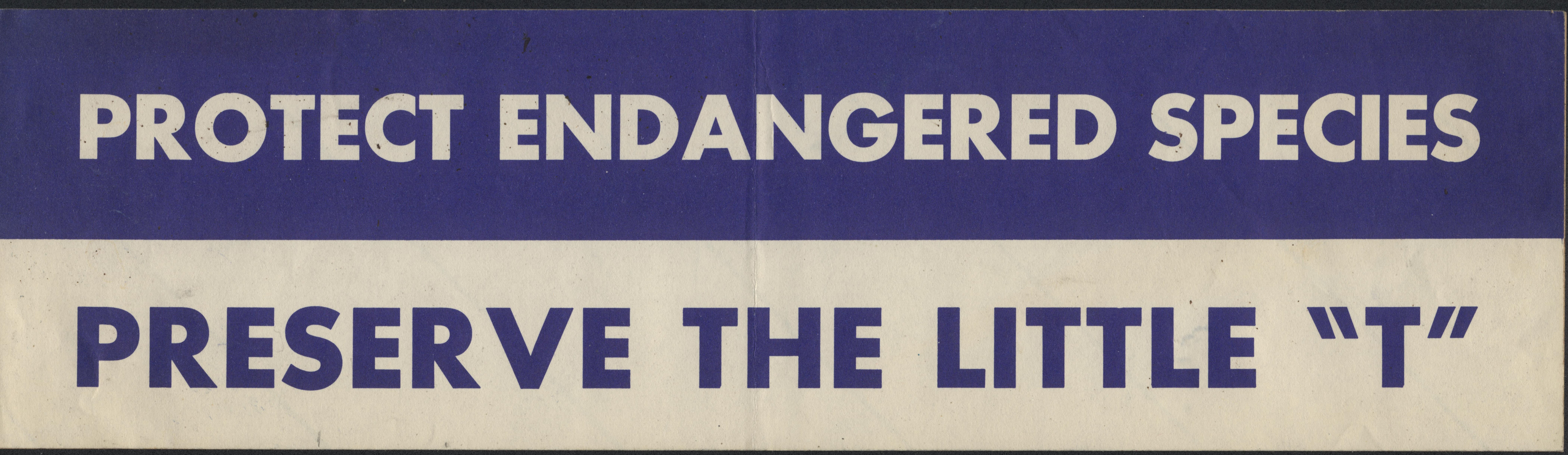 Bumper sticker divided in half lengthwise; top half is blue with white letters "PROTECT ENDANGERED SPECIES" bottom half is white with blue letters "PRESERVE THE LITTLE 'T'"