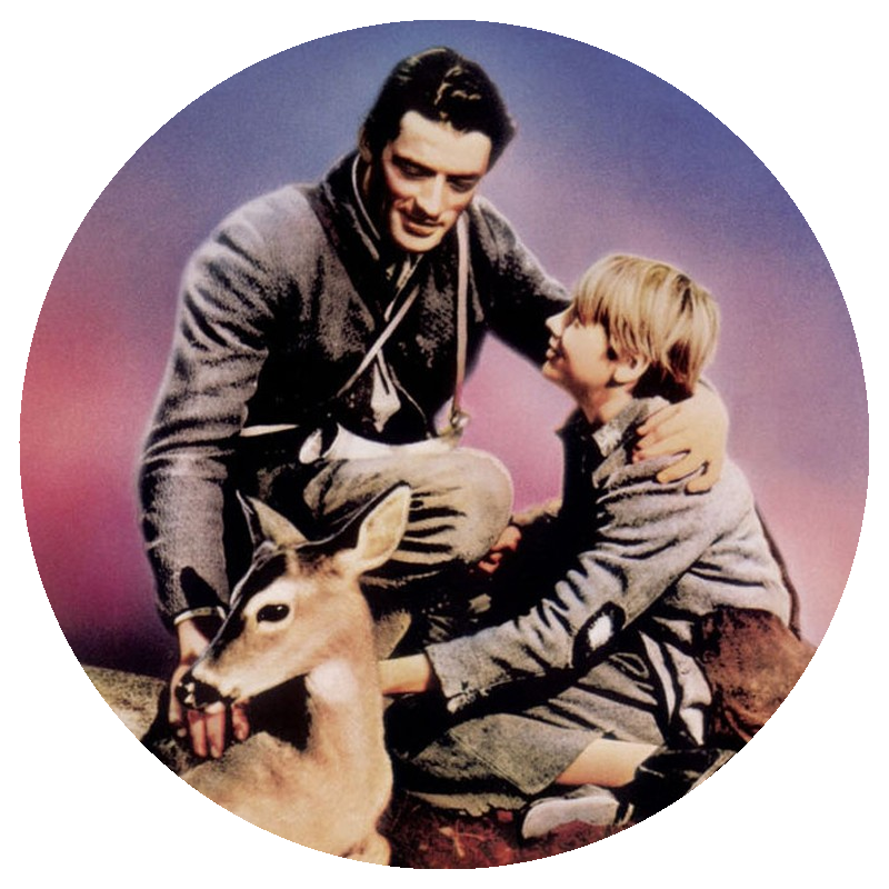Gregory Peck and Claude Jarman Jr. pet a fawn