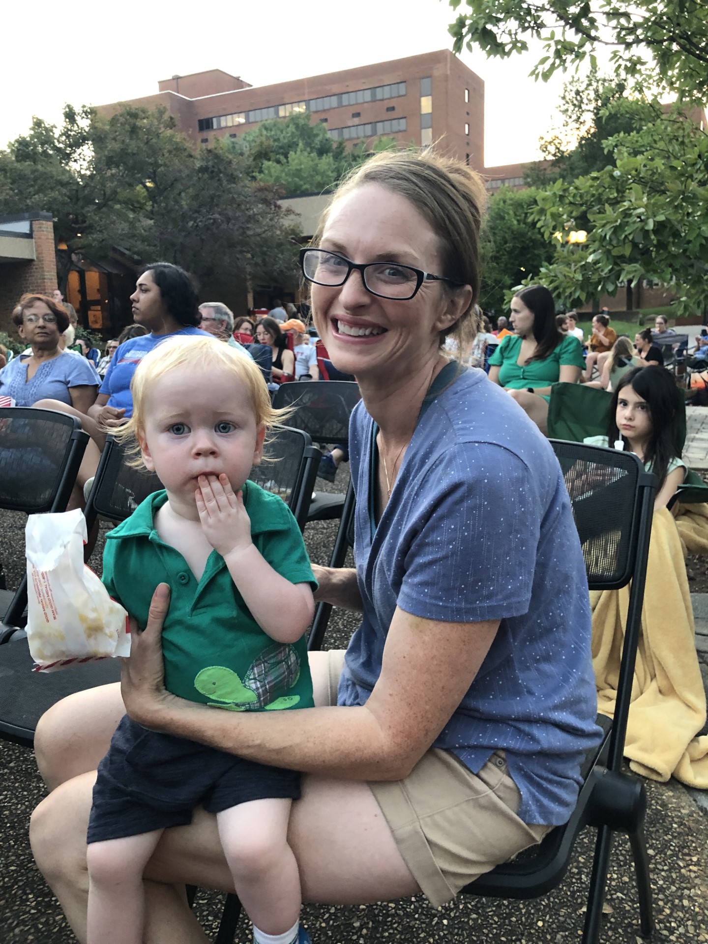 Mom holds young boy on lap