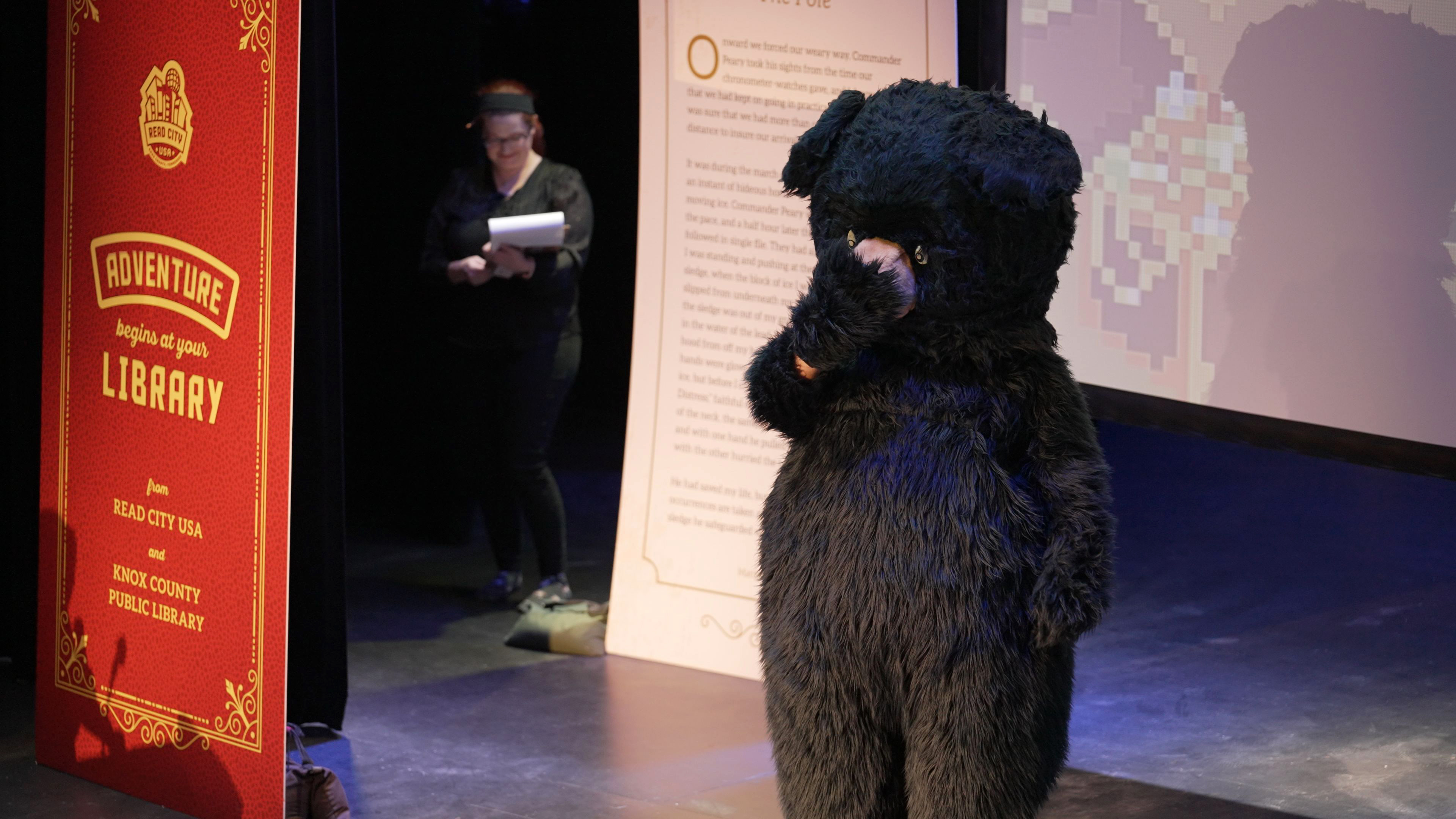 costume bear making embarrassed gesture