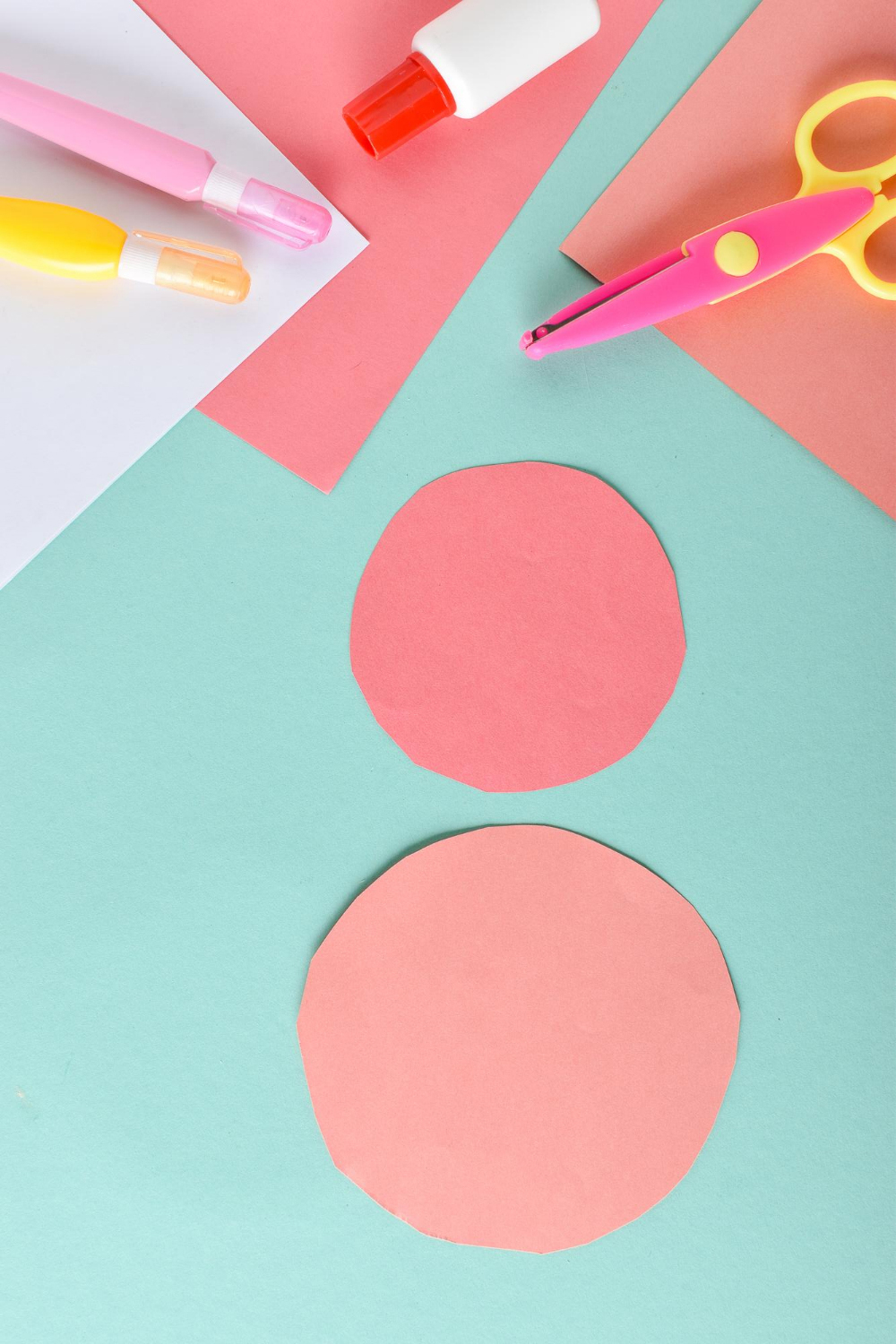 photo of two cut paper circles and other craft materials