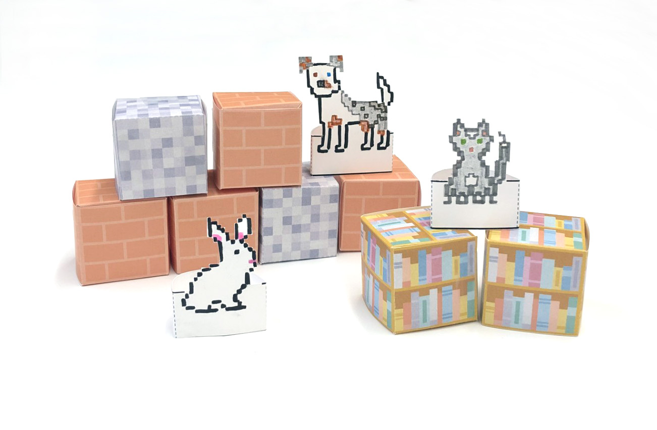 photo of paper block craft with brick, stone, and bookshelf patterns