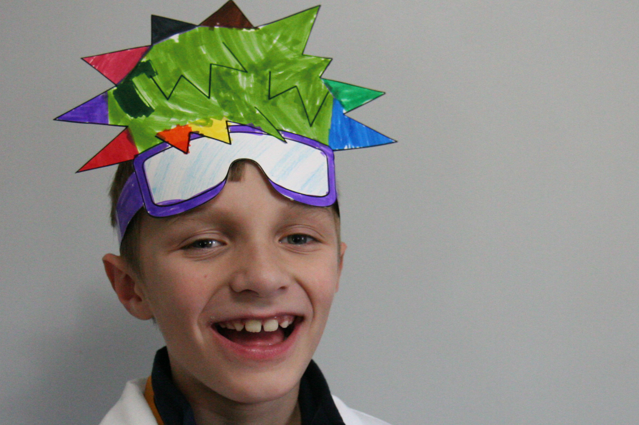 photo of child wearing colorful hair from a paper craft