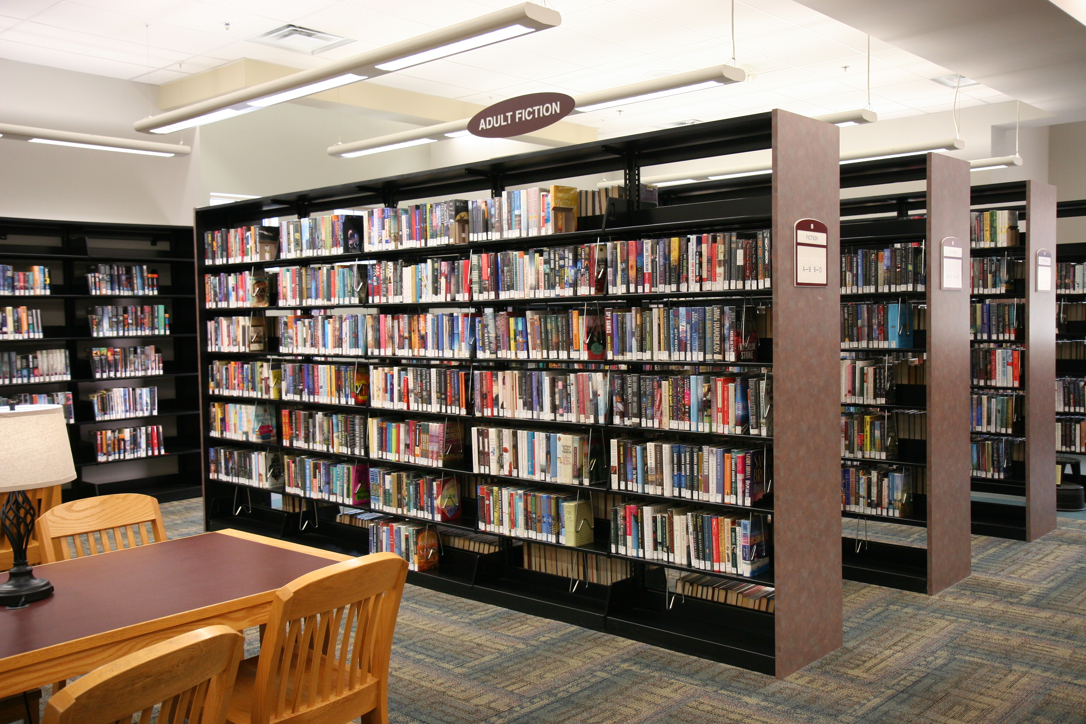 interior photo of library table and shelves