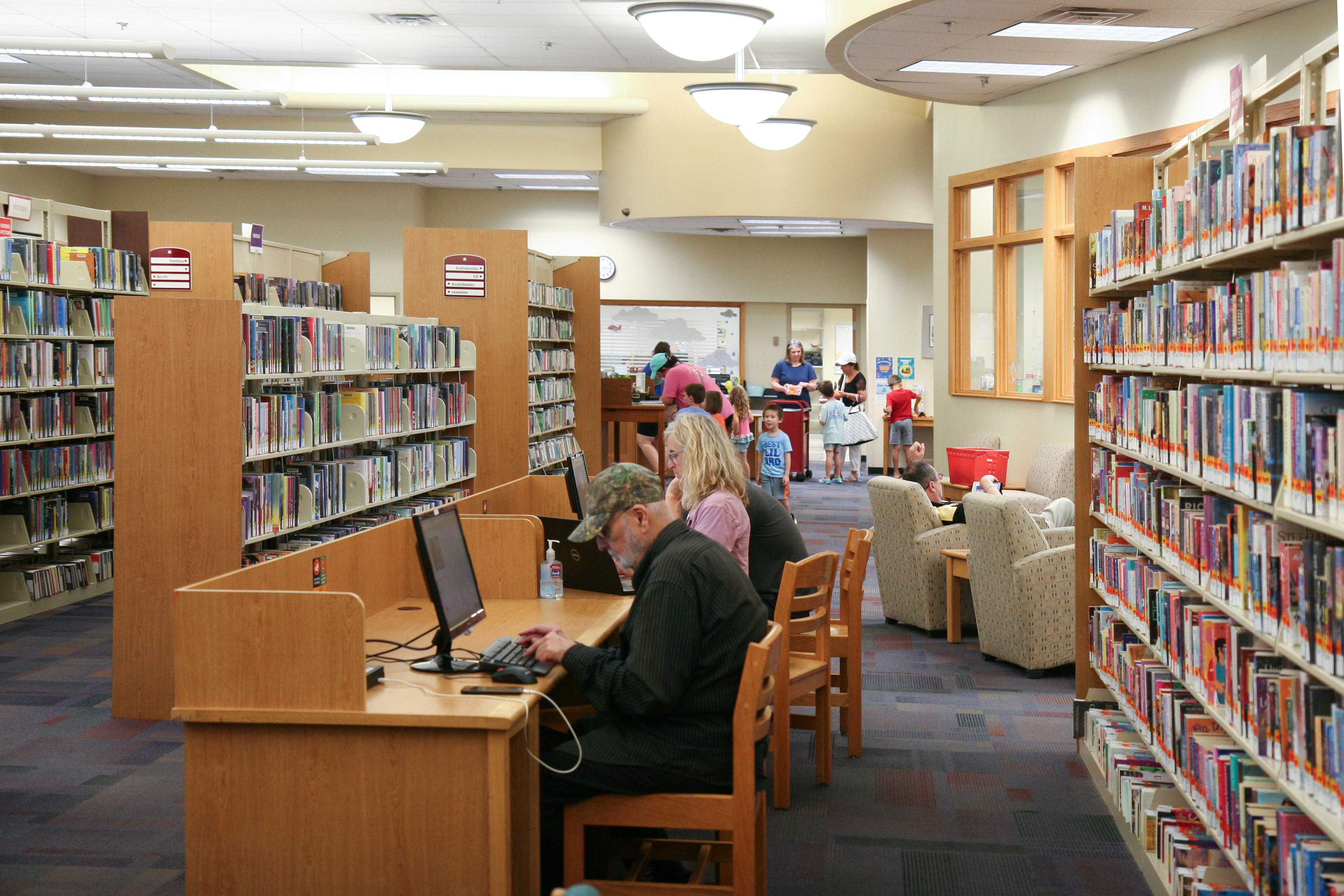 photo of patrons at computers in a library