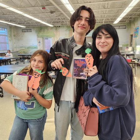family showing off a carrot craft