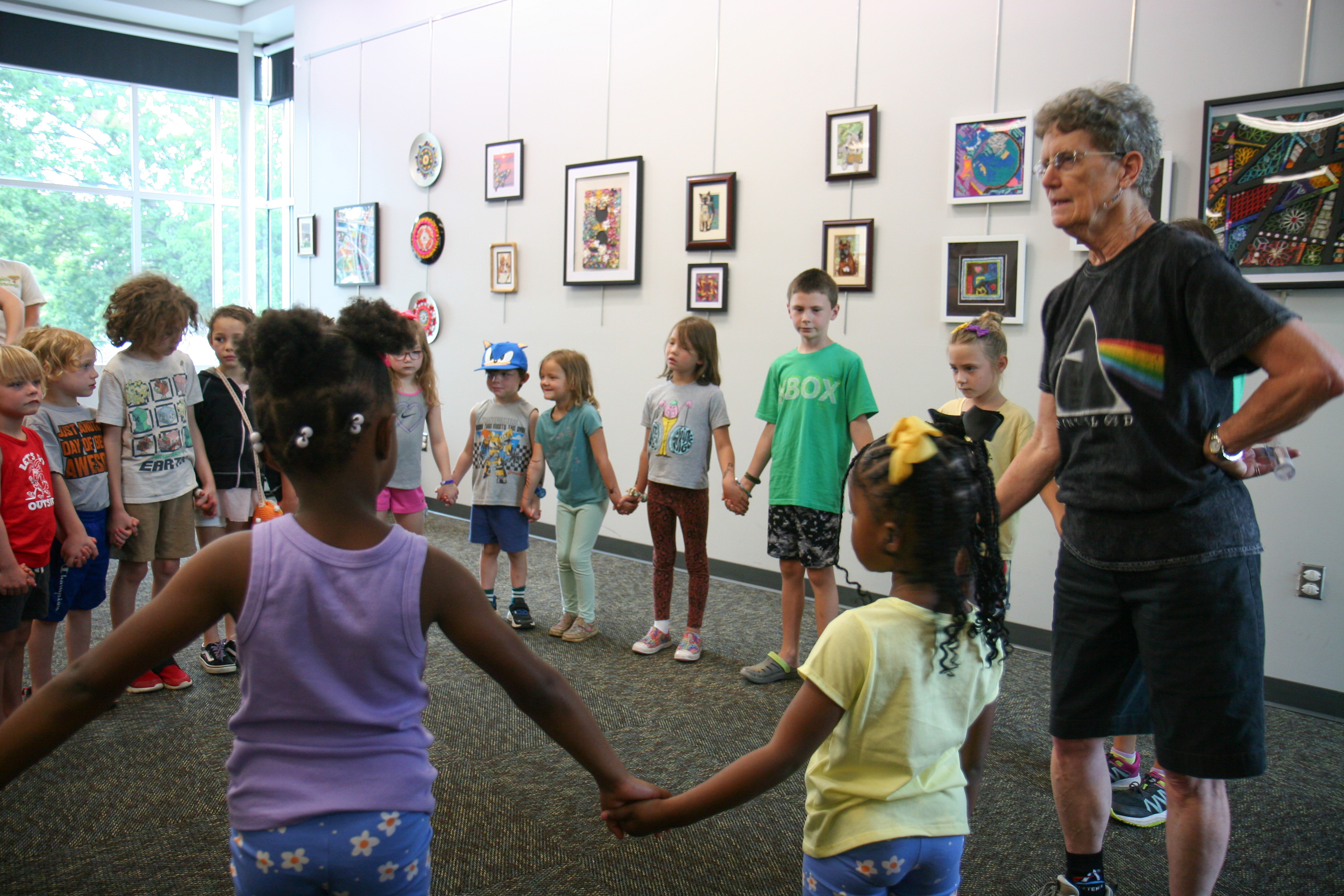 kids holding hands in a circle