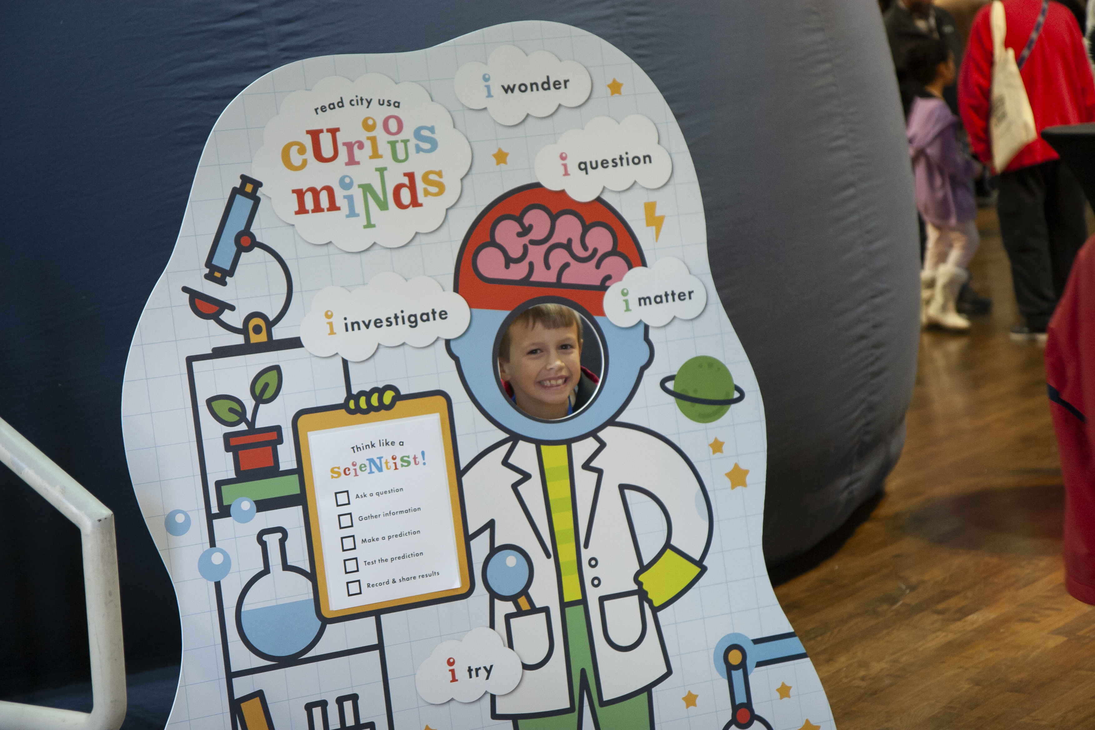 child in a photo cutout of a scientist