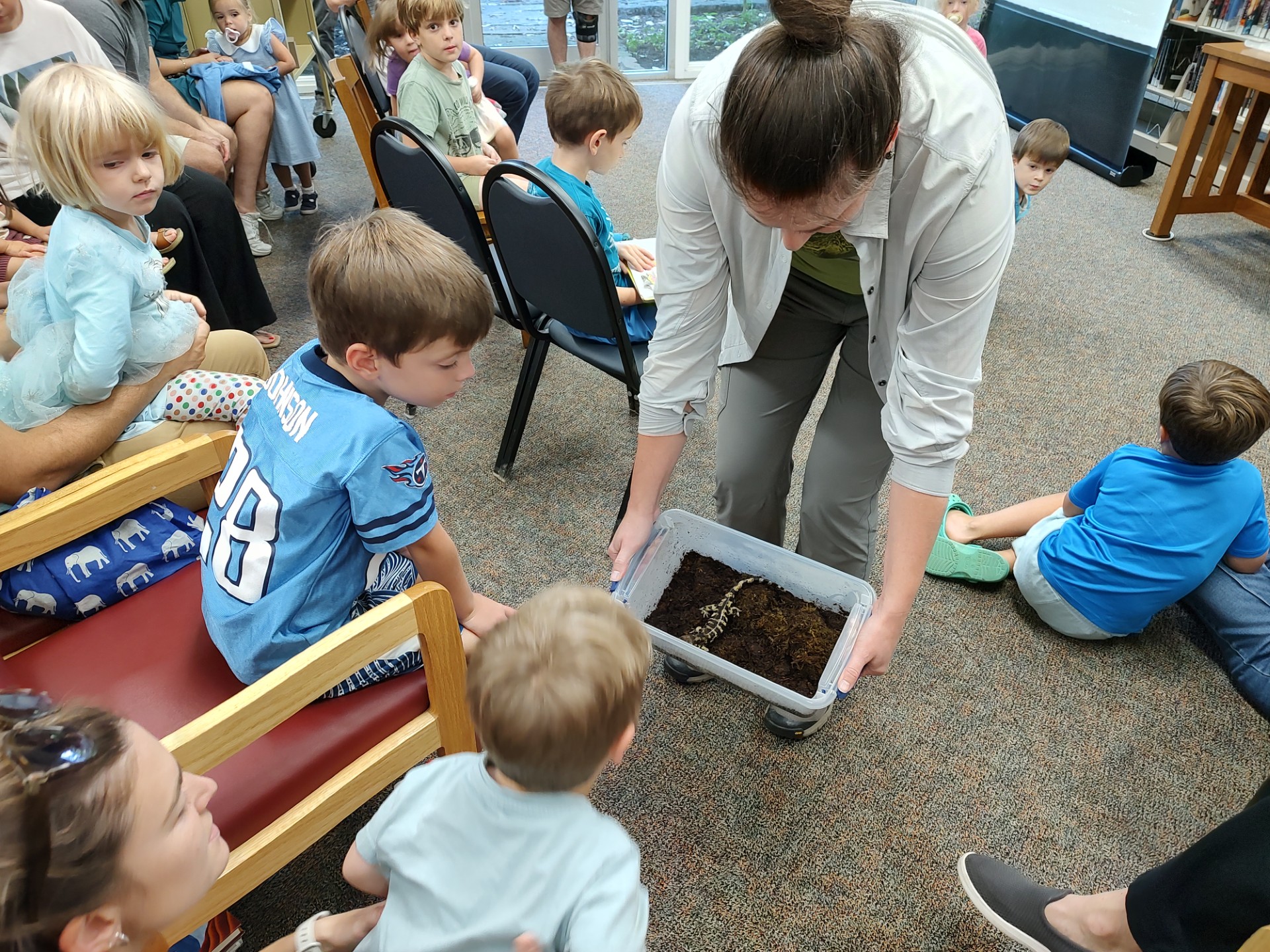 kids examining a salamander