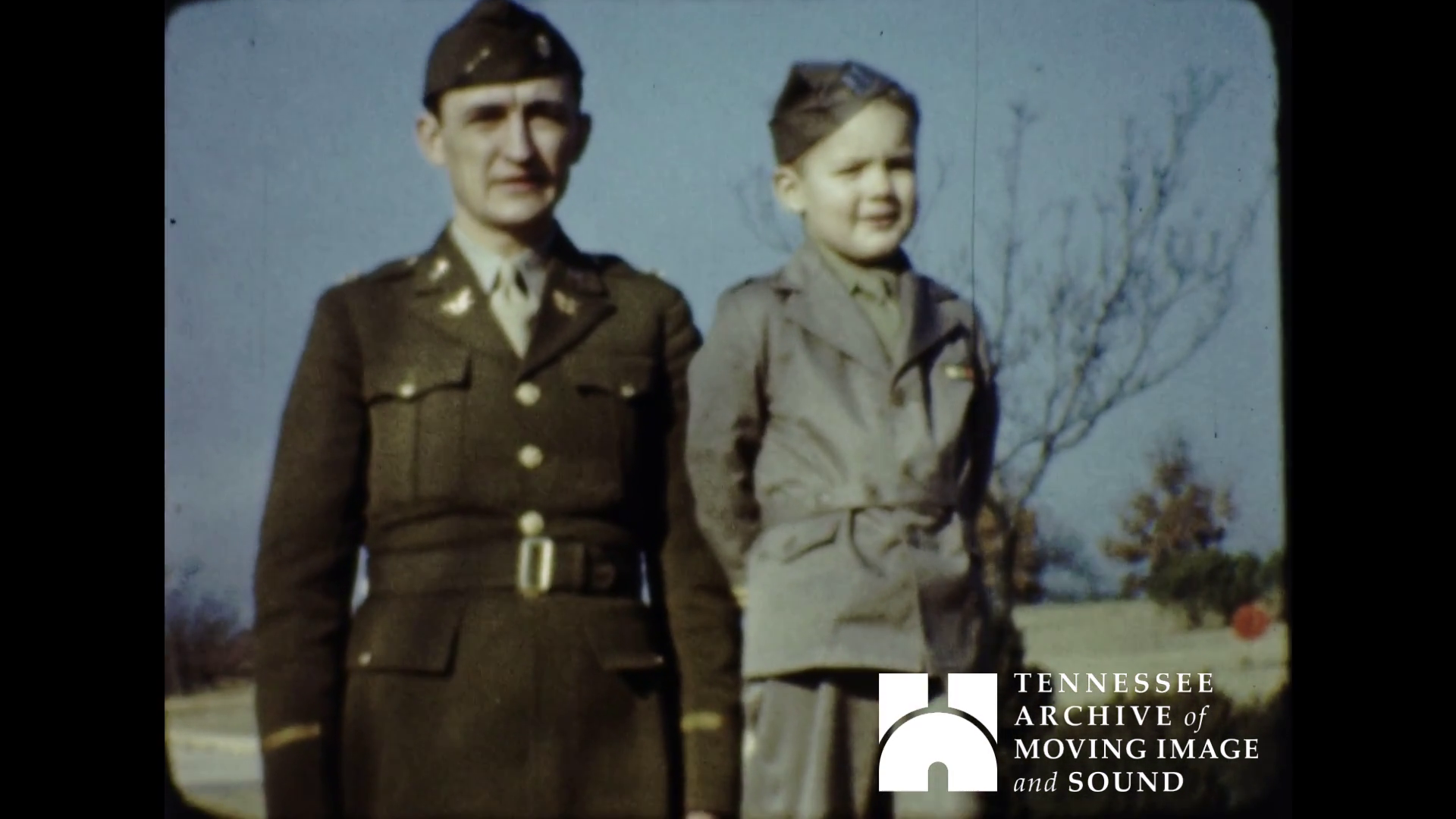 Young Julie Webb with her father in uniform
