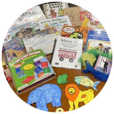 photo of books, games, flannelboard elements, cds, and scarves