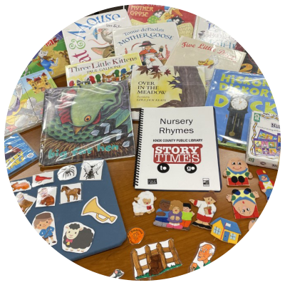 photo of books, games, and flannelboard elements