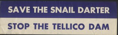 Bumper sticker divided in half lengthwise; top half is blue with white letters "SAVE THE SNAIL DARTER" and bottom half is white with blue letters "STOP THE TELLICO DAM"