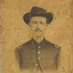 Sepia portrait of a man in a US Army uniform. The man's name is hand-written below his portrait "Will A. McTeer"