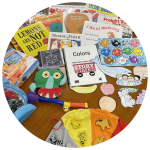 photo of books, colorful fish puzzle, games, and cutouts