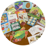 photo of food related games, toys, puzzles, books, flash cards, and flannelboard story elements