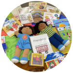 photo of books, dolls, puzzles, a cd, and flannelboard elements