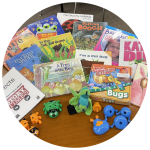 photo of books, finger puppets, games, and a puzzle