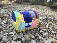 photo of paper treasure chest craft, colored with bright, messy markers