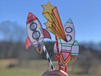 photo of paper rockets on colorful straws