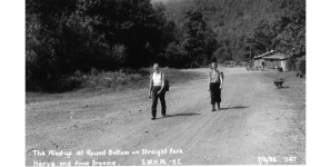 photo of man and woman hiking a dirt road 1938