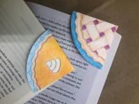 photo of pie-shaped bookmarks on corners of books