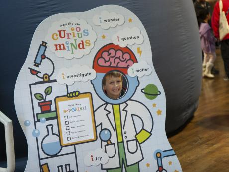child in a photo cutout of a scientist