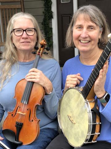 photo of two women with banjo and fiddle