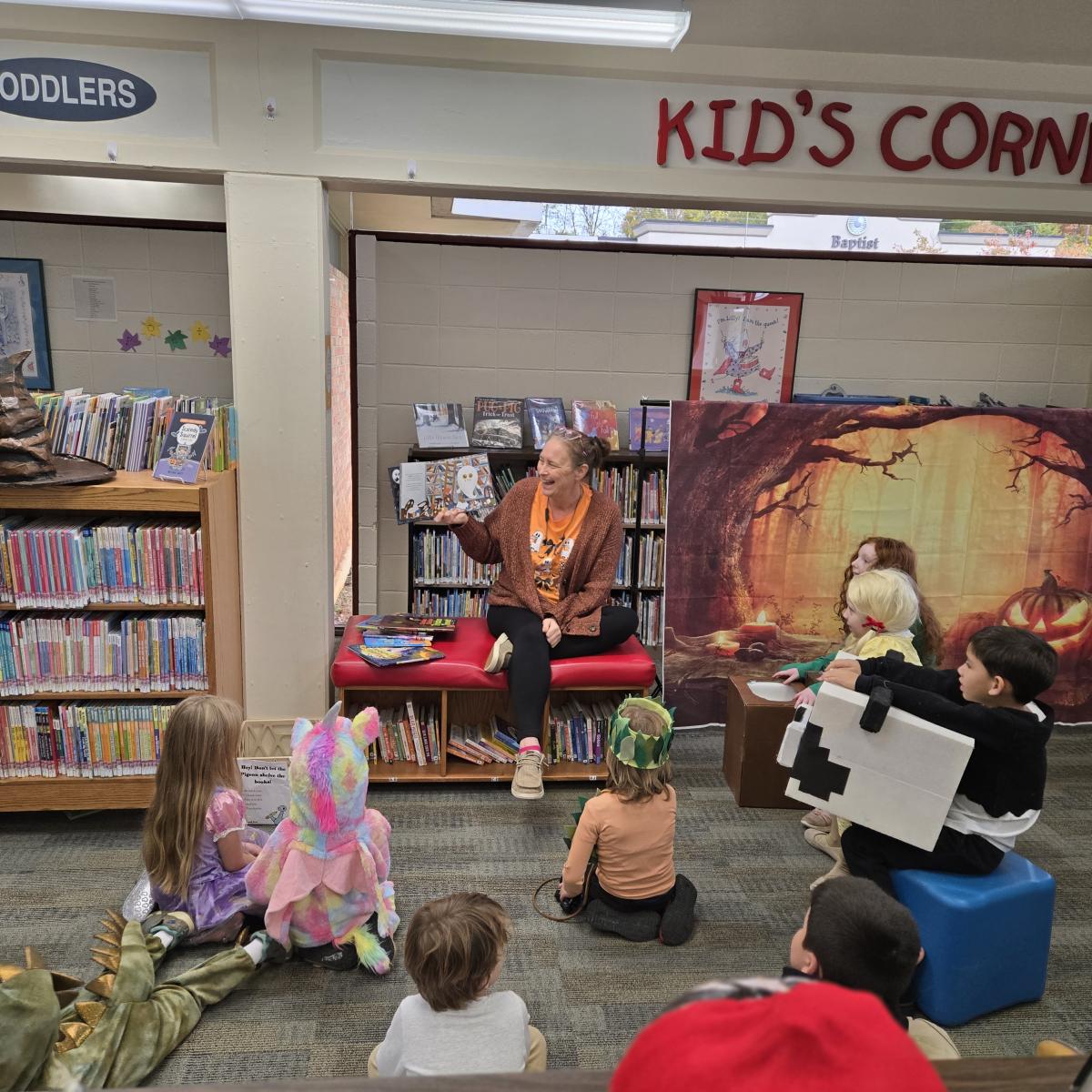 photo of seated kids listening to a story