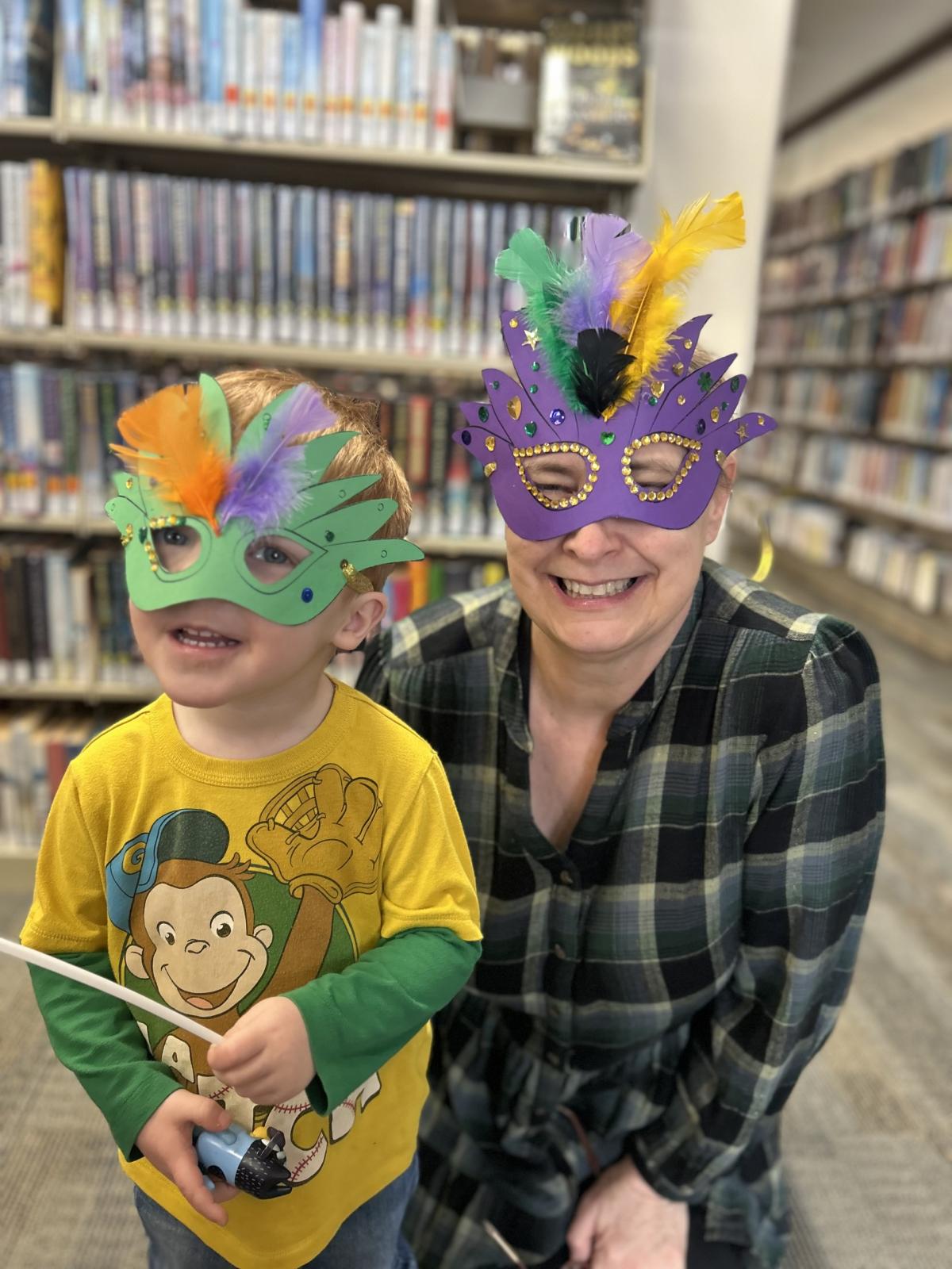 librarian with child in mardi gras masks