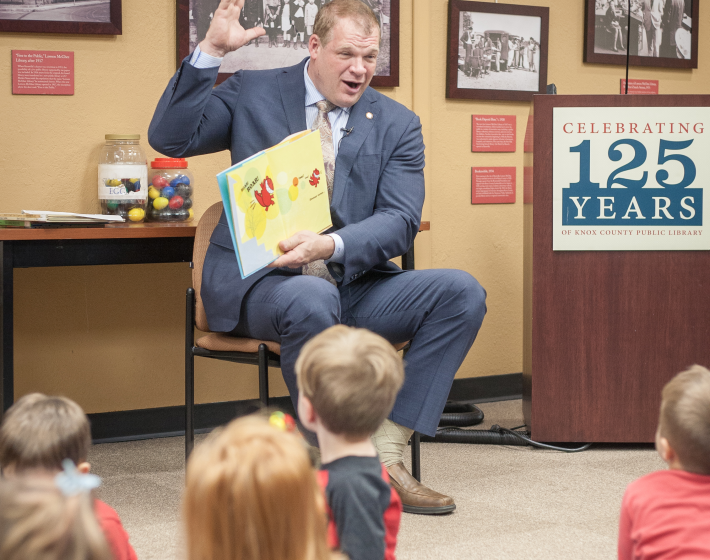 Mayor reading to a group of children
