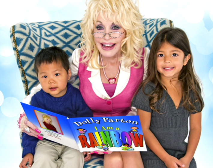 Dolly and two children reading a book