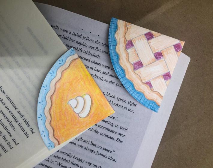 photo of pie-shaped bookmarks on corners of books