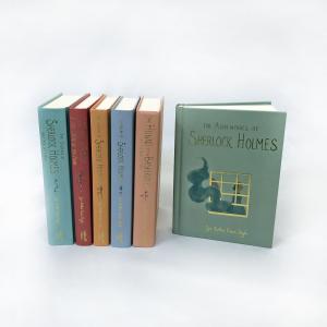 Photo of six cloth-bound Sherlock Holmes titles, with foil accents