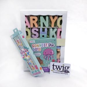 photo of children's gift items, alphabet chalk, colored pencils, and Twig gift card