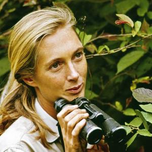 photo of Jane Goodall as a young woman, holding binoculars